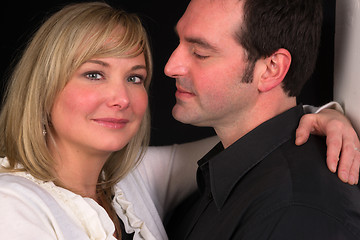 Image showing Young Couple Man Woman Engaged Standing Hugging Kissing Embracin