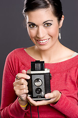 Image showing Pretty woman in Red with vintage field camera