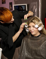 Image showing Stylist Positions Curlers On Model During Artwalk Event Salon Ta