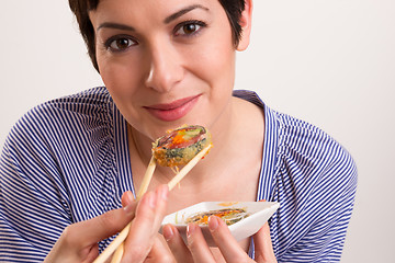 Image showing Candid Close Portrait Cute Brunette Woman Raw Food Sushi Lunch