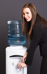 Image showing Pretty Brunette Woman Office Staff Water Cooler Workplace Drink