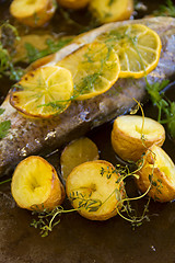 Image showing Potatoes And Lemon On Trout Fillet