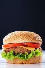 Image showing Cheeseburger with tomatoes and lettuce