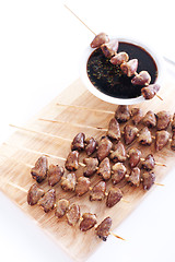 Image showing Grilled chicken hearts on skewers