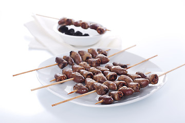 Image showing Grilled chicken hearts on skewers