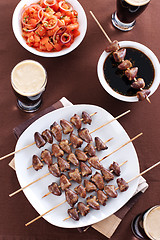 Image showing Grilled chicken hearts on skewers