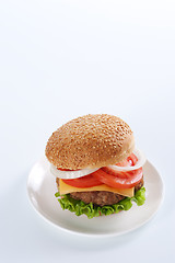 Image showing Cheeseburger with tomatoes and lettuce