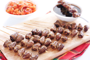 Image showing Grilled chicken hearts on skewers