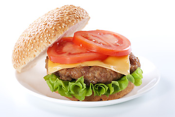 Image showing Cheeseburger with tomatoes and lettuce