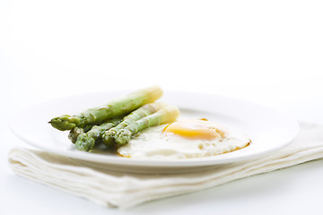 Image showing Asparagus and fried eggs