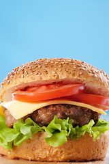 Image showing Cheeseburger with tomatoes and lettuce