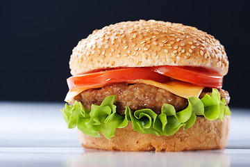 Image showing Cheeseburger with tomatoes and lettuce