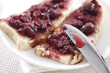 Image showing Cherry jam on toast