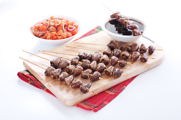 Image showing Grilled chicken hearts on skewers