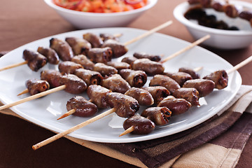 Image showing Grilled chicken hearts on skewers