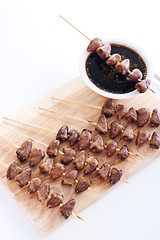 Image showing Grilled chicken hearts on skewers