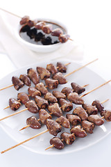 Image showing Grilled chicken hearts on skewers