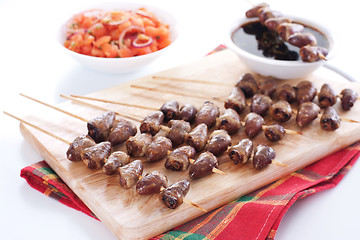 Image showing Grilled chicken hearts on skewers