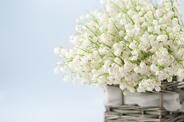 Image showing Basket with lilies of the valley 