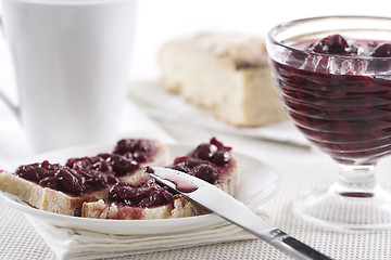 Image showing Cherry jam on toast