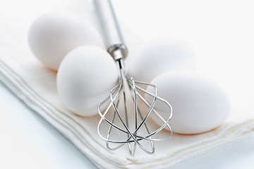 Image showing Whisk and fresh eggs