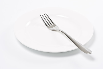 Image showing Empty plate and fork