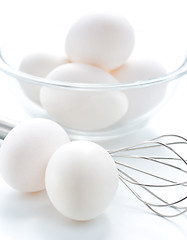 Image showing Whisk and fresh eggs