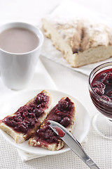 Image showing Cherry jam on toast