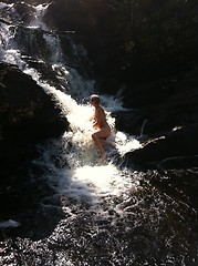 Image showing woman in waterfall