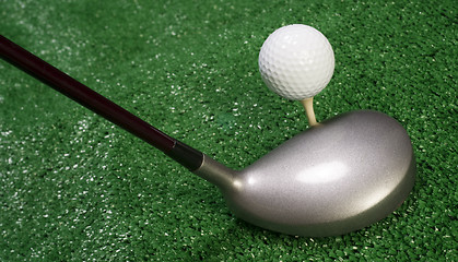 Image showing Club Sitting in Front of Teed Up Golf Ball