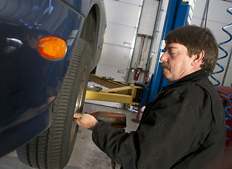 Image showing Automotive Technician Uses Pneumatic Impact Wrench Auto Repair B