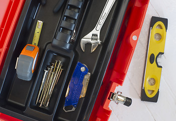 Image showing Orange Tool Box Wrench Measuring Tape and Level