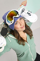 Image showing Snowboard and Fun Loving Female in Teal