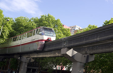 Image showing Seattle Monorail Transit Train Travels Over Neighborhood Retro S