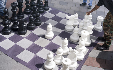 Image showing Man Moves Piece People Playing Giant Chess Game Sidewalk Downtow