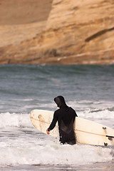 Image showing Man Black Wetsuit Enters Ocean Surf Holding Surfboard Summer Spo