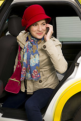 Image showing Woman exits a Taxi