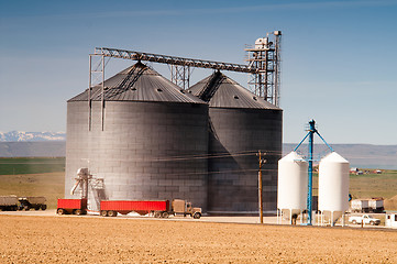 Image showing Agricultural Silo Loads Semi Truck With Farm Grown Food Grain