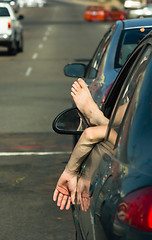 Image showing Man Driver Hangs Foot and Hand out Car Window