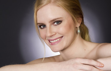 Image showing Beautiful Blond Smiling Big in Head and Shoulders Beauty Pose