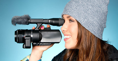 Image showing Hip Young Adult Female Points Video Camera