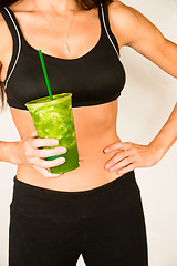 Image showing Slender Female Torso Tanned Toned Body Blended Fruit Smoothie Dr