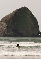 Image showing Surfer Tries Catching Small Wave Rocky Butte Pacific Ocean 