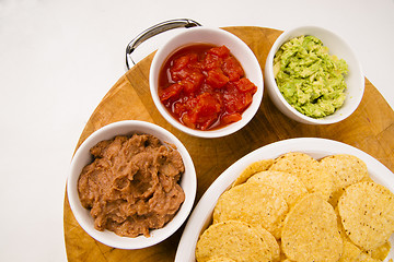 Image showing Chips Salsa Refried Beans Guacamole Nachos Food Fresh Appetizer