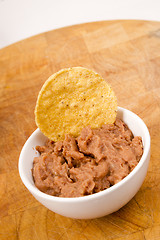 Image showing Corn Chip Buried in Refried Beans Dish Snack Appetizer