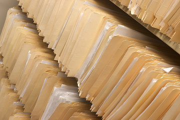 Image showing Rows of File Folders Arranged on Shelf with Client Data