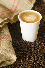 Image showing Cappuccino To Go Paper Cup Burlap Bag Roasted Coffee Beans