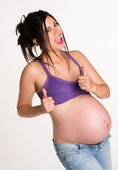 Image showing Attractive Pregnant Woman Gives A-OK Hand Signal Thumbs Up