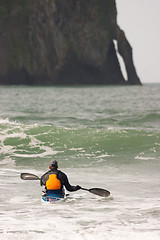 Image showing Man Paddles into Ocean Surf Riding Sea Kayak Boat Sport