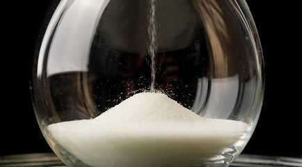 Image showing Sand Falling in Hourglass Close Up